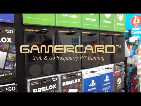 Compact GamerCard device showcasing its credit card size and retro game interface